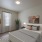 bedroom with bed and art on walls
